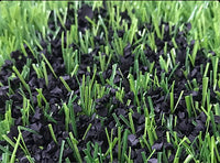 Why should artificial grass turf be filled with particles