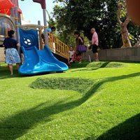Kindergarten artificial turf paving attention